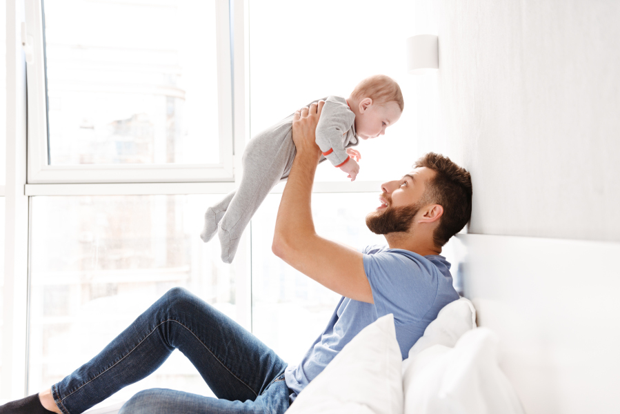 Handsome happy young man father dad having fun with his little baby Gdzie jesteś tato?
